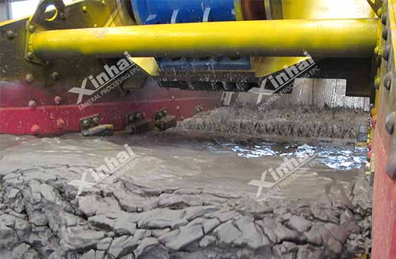A picture shows the tailings dewatering process